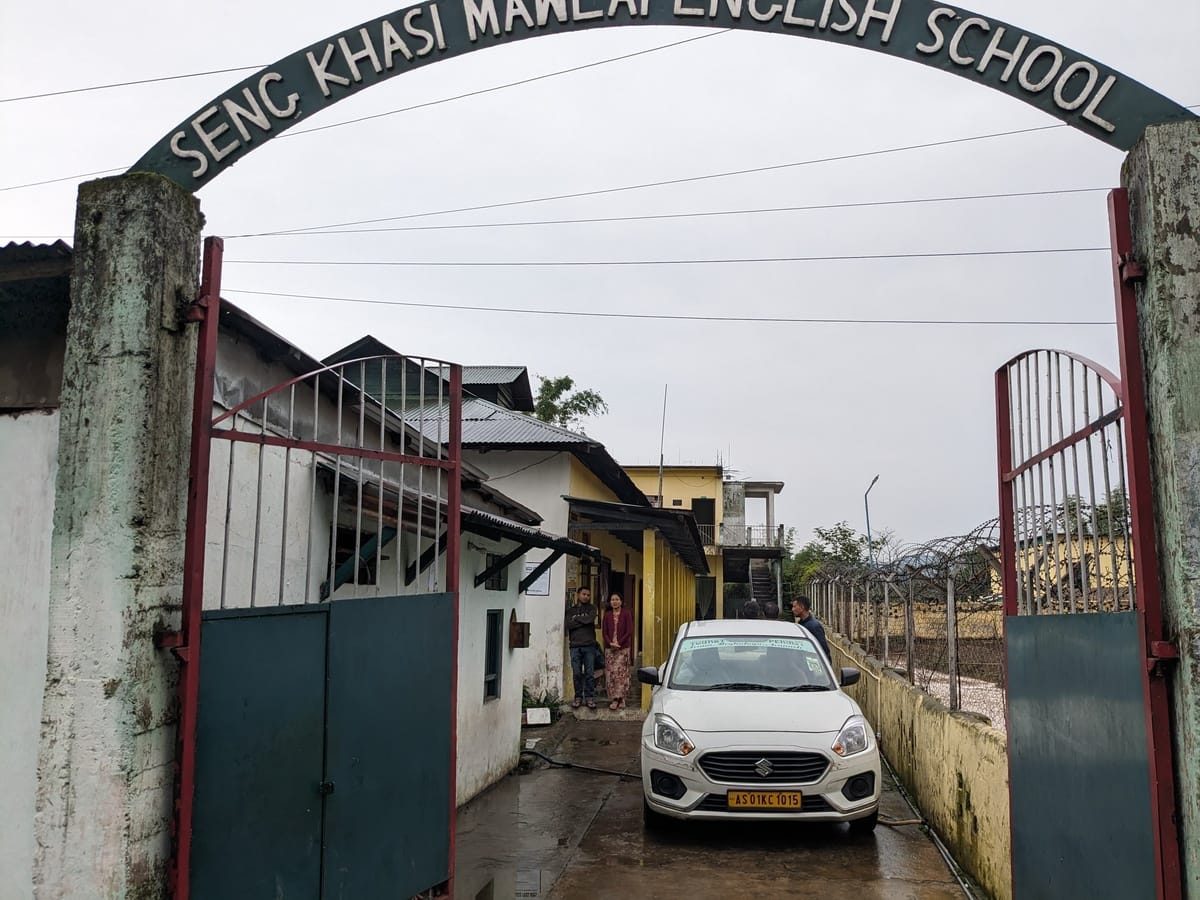 The arched front gate of Seng Khasi Mawlai English School, Meghalaya, on a wet morning