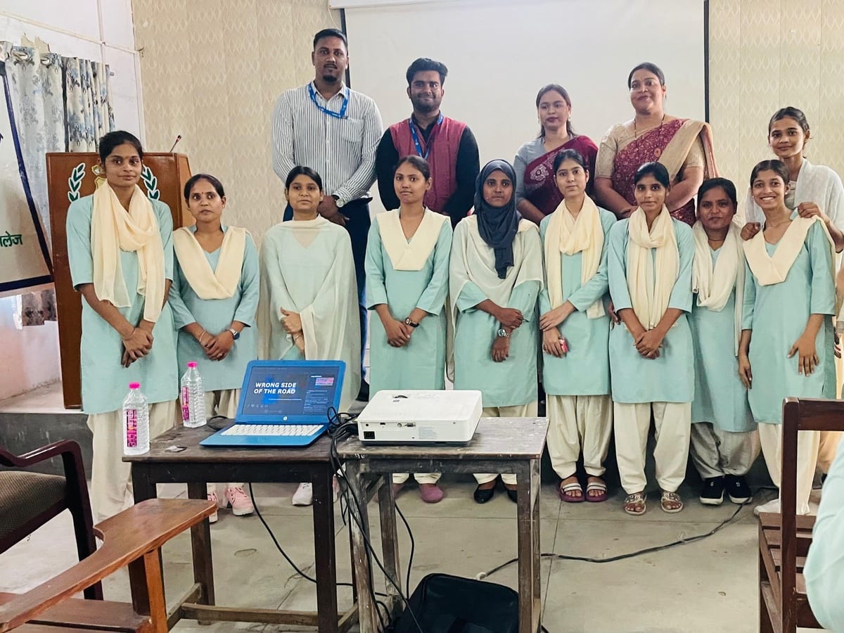 Students in pale green uniforms standing in a row with facilitators and staff behind them at a PG college in Lucknow