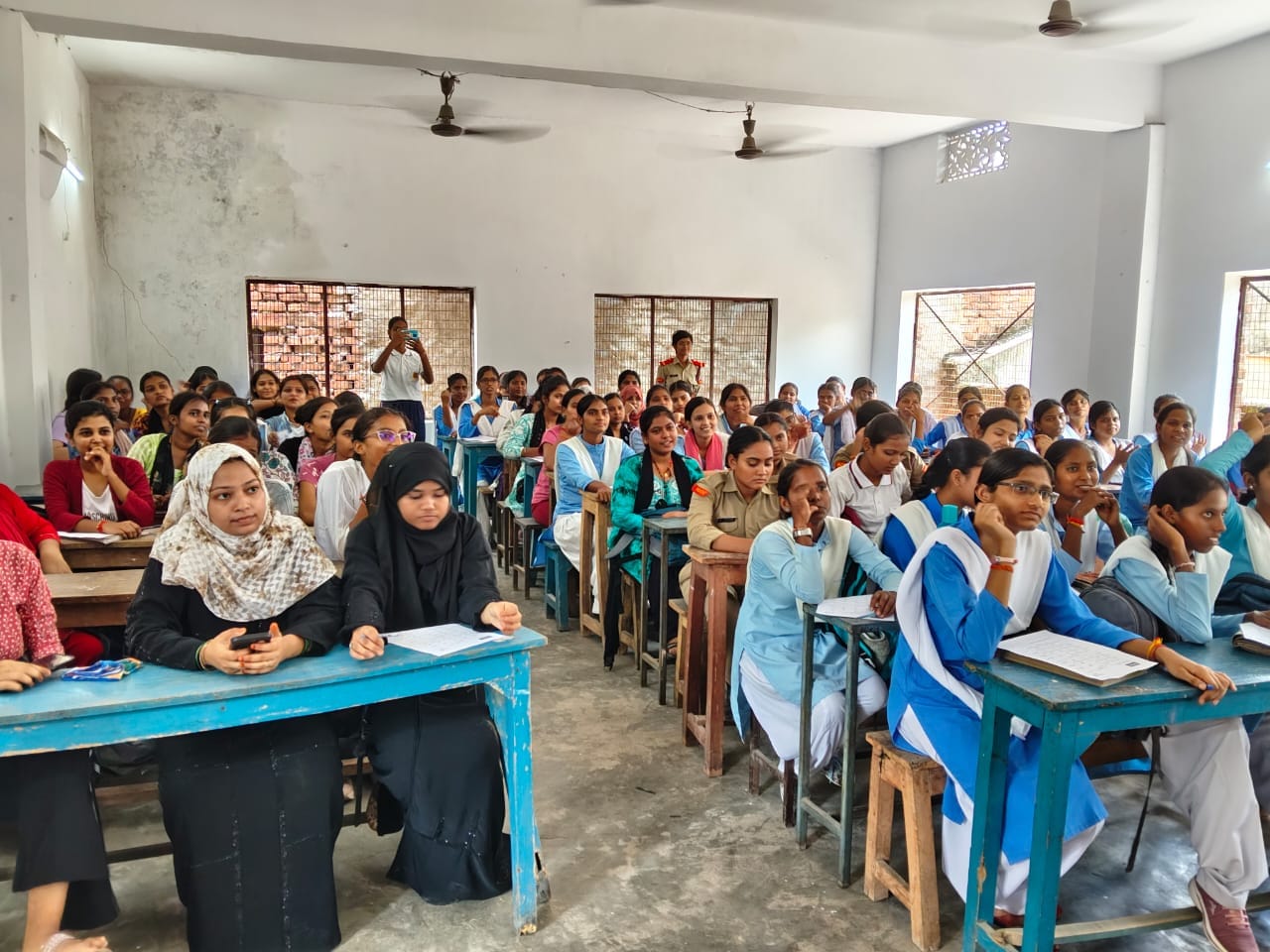 Students seated at desks in a rural government school classroom in Lucknow during an AI literacy session.
